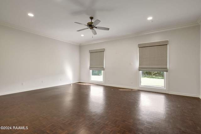 empty room featuring dark parquet floors, ceiling fan, and ornamental molding