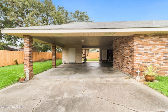 view of parking featuring a carport and a yard