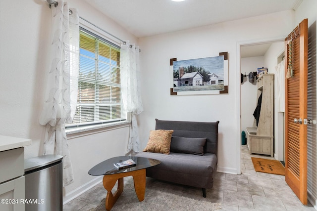 living area featuring light tile patterned flooring