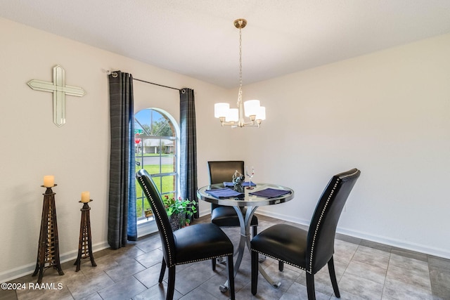 dining area featuring a notable chandelier