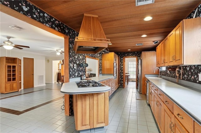 kitchen featuring light tile patterned floors, visible vents, custom range hood, a sink, and wooden ceiling