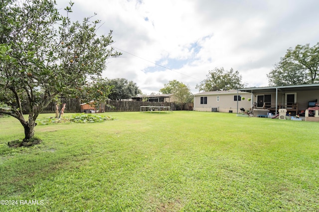 view of yard with a trampoline