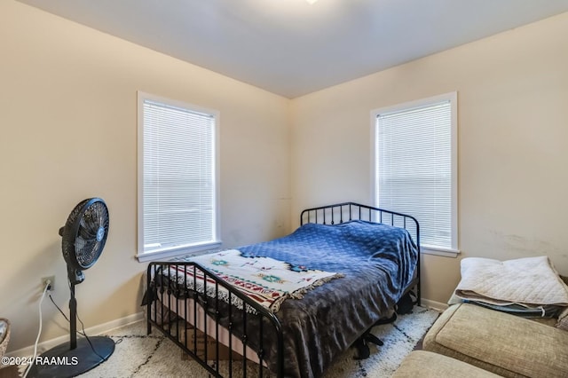 bedroom with light carpet