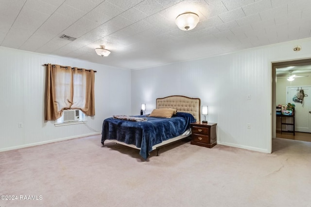 carpeted bedroom featuring cooling unit and crown molding