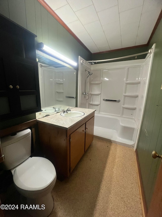 full bathroom featuring washtub / shower combination, vanity, toilet, and ornamental molding