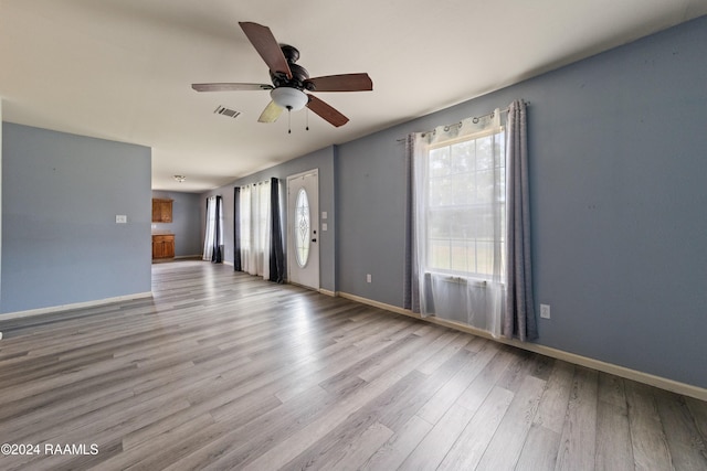 unfurnished room with ceiling fan and light hardwood / wood-style flooring