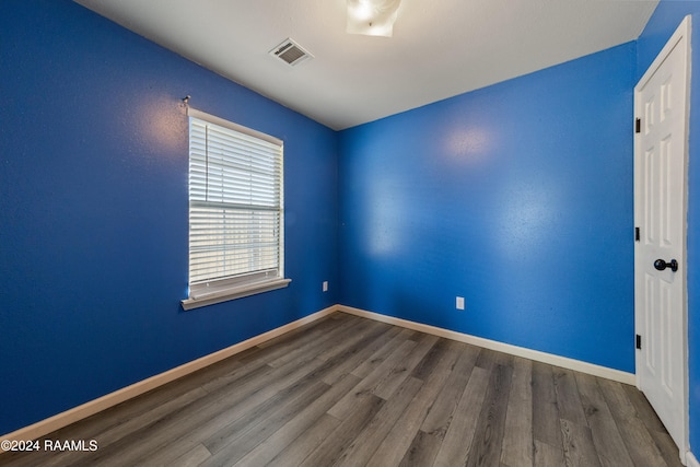 unfurnished room featuring hardwood / wood-style floors