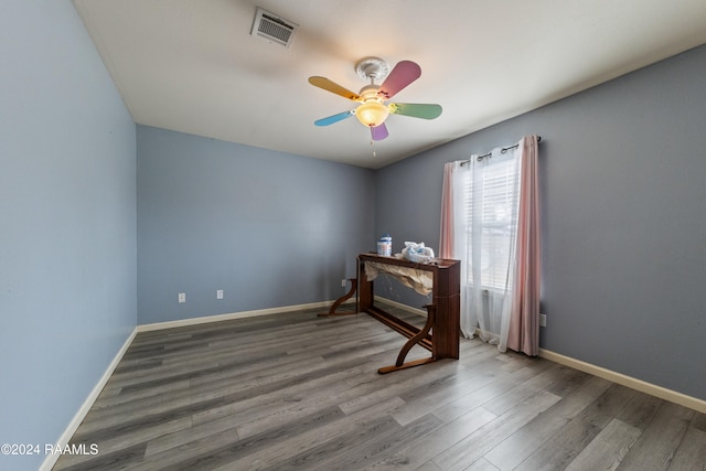 unfurnished bedroom with hardwood / wood-style flooring and ceiling fan