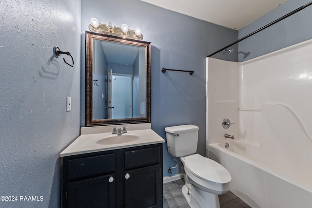 full bathroom featuring shower / bathing tub combination, vanity, and toilet