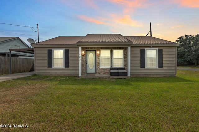 view of front of home with a yard