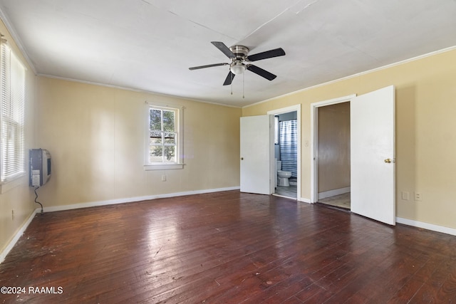 unfurnished room with ceiling fan, dark wood-type flooring, and ornamental molding