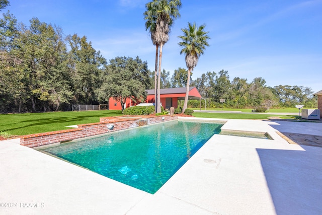 view of swimming pool with a lawn and a patio