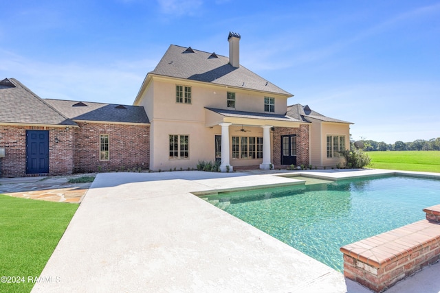 view of pool featuring a patio and ceiling fan