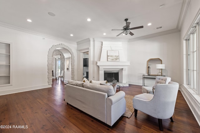 living room with ceiling fan, dark hardwood / wood-style flooring, and a wealth of natural light