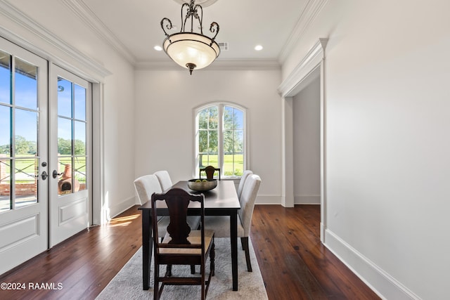 dining room with crown molding, french doors, and dark wood-type flooring