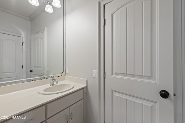 bathroom featuring vanity and ornamental molding