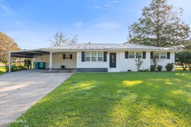 ranch-style house with a carport and a front yard