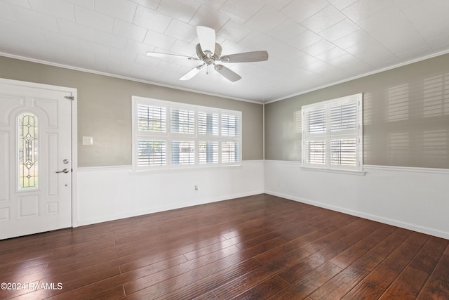 entrance foyer featuring plenty of natural light, ceiling fan, dark hardwood / wood-style flooring, and crown molding