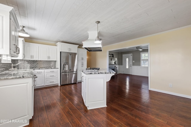 kitchen featuring a center island, dark hardwood / wood-style flooring, stainless steel appliances, and white cabinetry