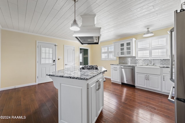 kitchen with white cabinets, decorative light fixtures, dark hardwood / wood-style flooring, and appliances with stainless steel finishes