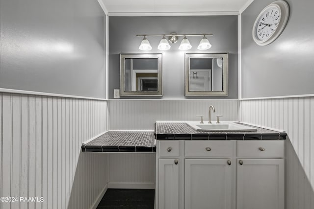 bathroom featuring vanity and crown molding