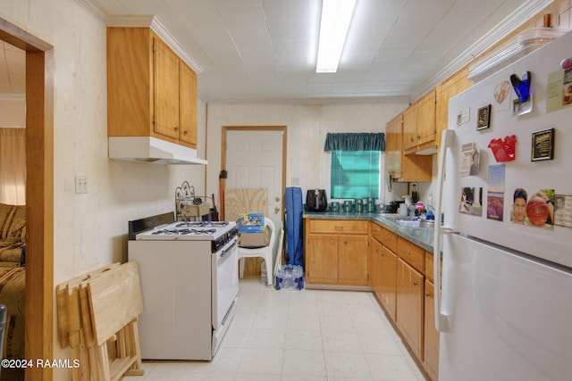 kitchen with white appliances, crown molding, and sink