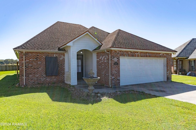 view of front of home with a garage and a front yard