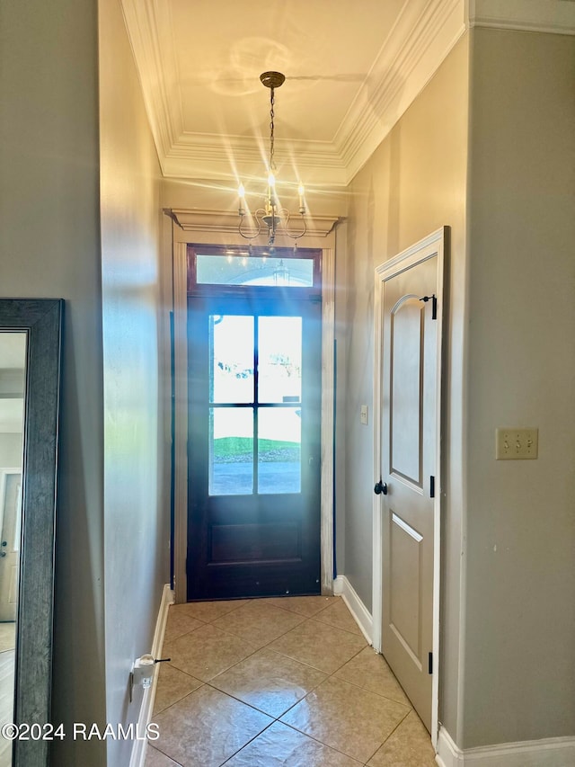 doorway with a chandelier, ornamental molding, and light tile patterned flooring