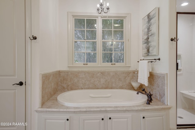 312 Shinnecock Hills Dr, Broussard, LA 70518 - full bath featuring a garden tub and a chandelier