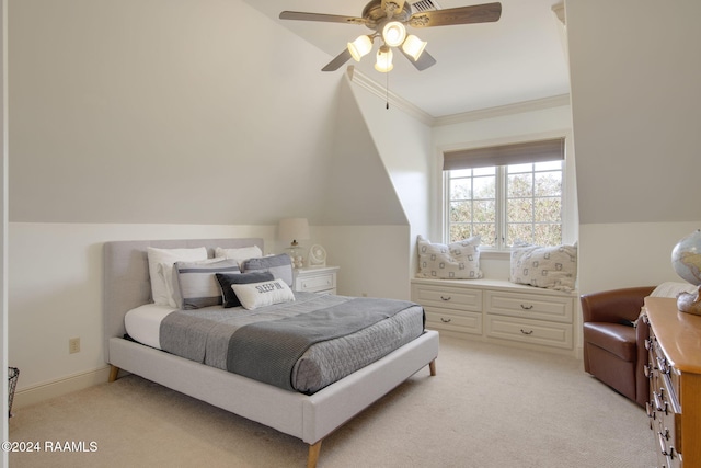 carpeted bedroom with ceiling fan, crown molding, and vaulted ceiling