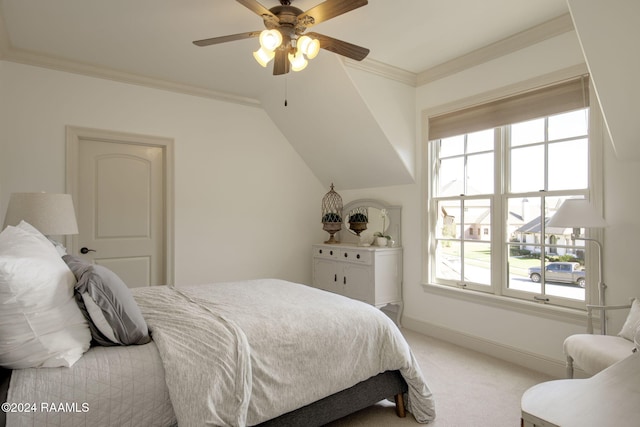 carpeted bedroom featuring ceiling fan, lofted ceiling, crown molding, and multiple windows