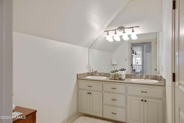312 Shinnecock Hills Dr, Broussard, LA 70518 - full bathroom with double vanity and vaulted ceiling