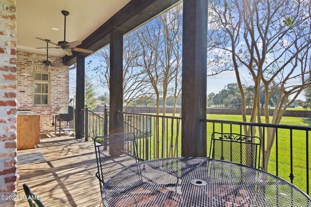 312 Shinnecock Hills Dr, Broussard, LA 70518 - wooden terrace featuring outdoor dining space and a ceiling fan