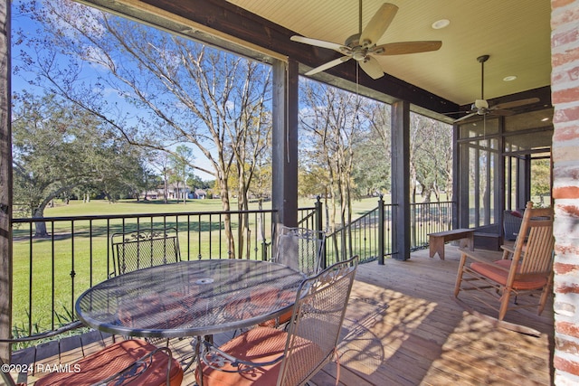 312 Shinnecock Hills Dr, Broussard, LA 70518 - wooden terrace featuring ceiling fan, a lawn, outdoor dining space, and view of golf course