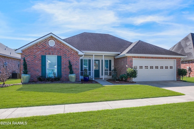 single story home featuring a garage and a front yard