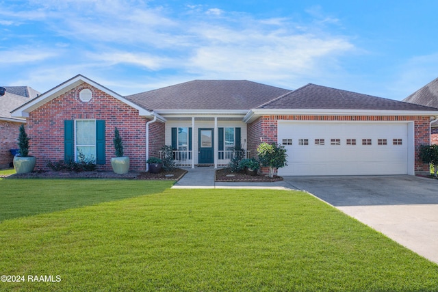 view of front of home with a porch, a garage, and a front yard