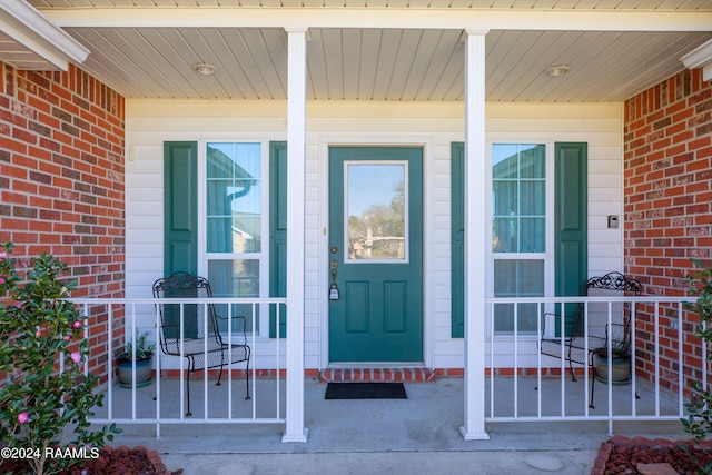 property entrance with covered porch