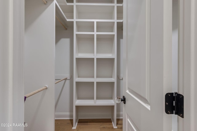 walk in closet featuring hardwood / wood-style flooring