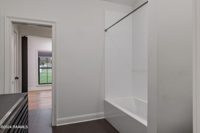 bathroom with tile patterned flooring and tiled shower / bath combo