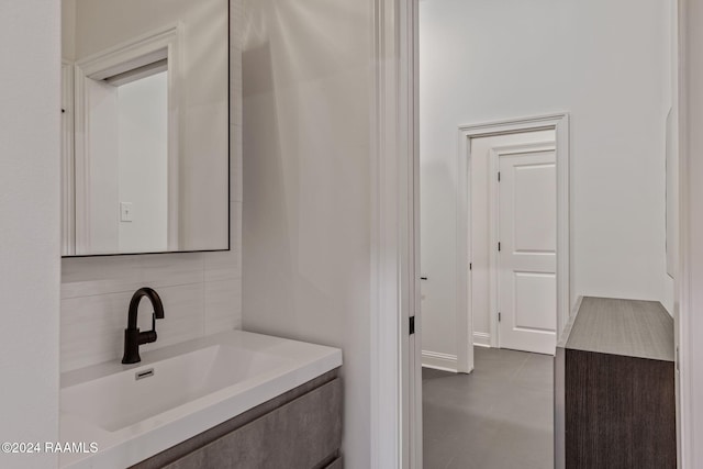 bathroom with vanity and backsplash