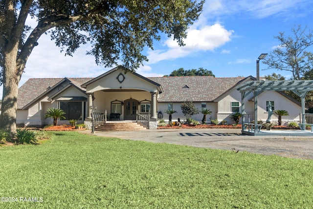 ranch-style home with a porch, a pergola, and a front lawn