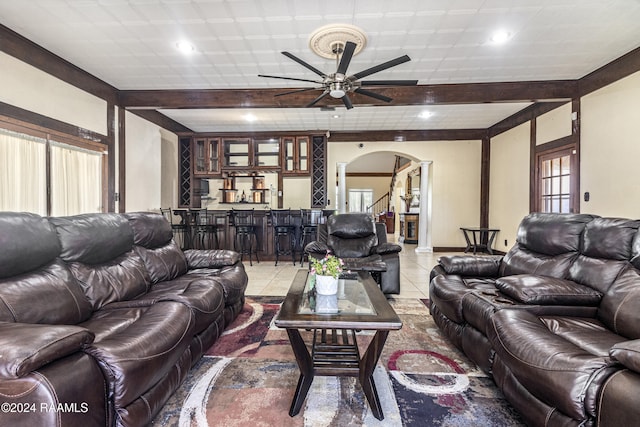1412 US Highway 167, Abbeville, LA 70510 - living area with arched walkways, bar area, a ceiling fan, recessed lighting, and plenty of natural light