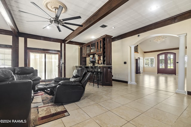 1412 US Highway 167, Abbeville, LA 70510 - living area with decorative columns, arched walkways, beamed ceiling, light tile patterned floors, and recessed lighting
