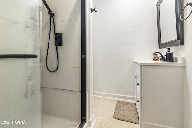 1412 US Highway 167, Abbeville, LA 70510 - bathroom featuring vanity, a stall shower, baseboards, and tile patterned flooring