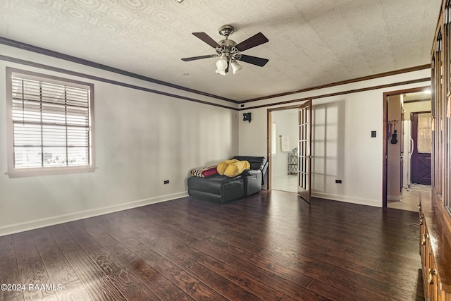 unfurnished room featuring crown molding, dark hardwood / wood-style flooring, ceiling fan, and french doors