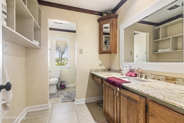 bathroom with tile patterned flooring, vanity, toilet, and crown molding