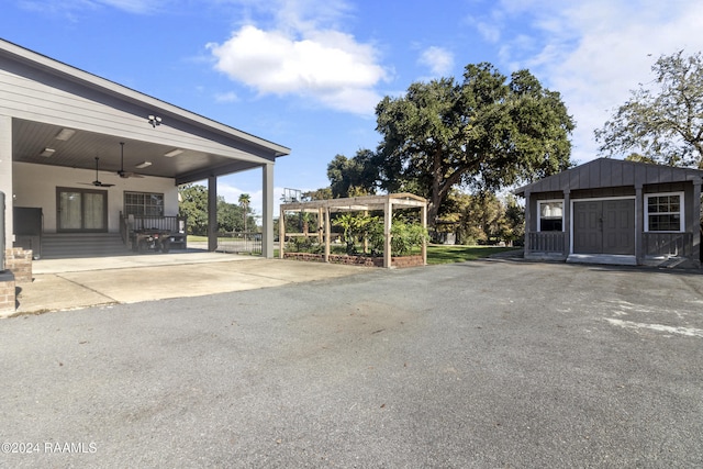 1412 US Highway 167, Abbeville, LA 70510 - view of yard with ceiling fan, an attached carport, and driveway