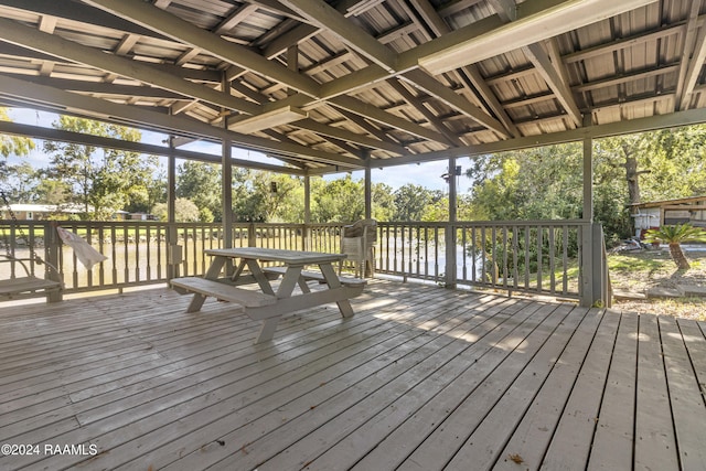 1412 US Highway 167, Abbeville, LA 70510 - deck with view of wooded area and outdoor dining space
