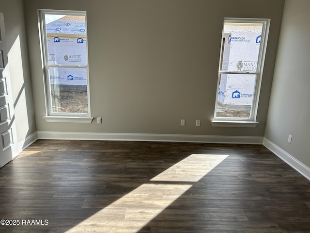 unfurnished room featuring dark hardwood / wood-style floors