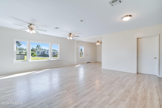 empty room with light hardwood / wood-style floors